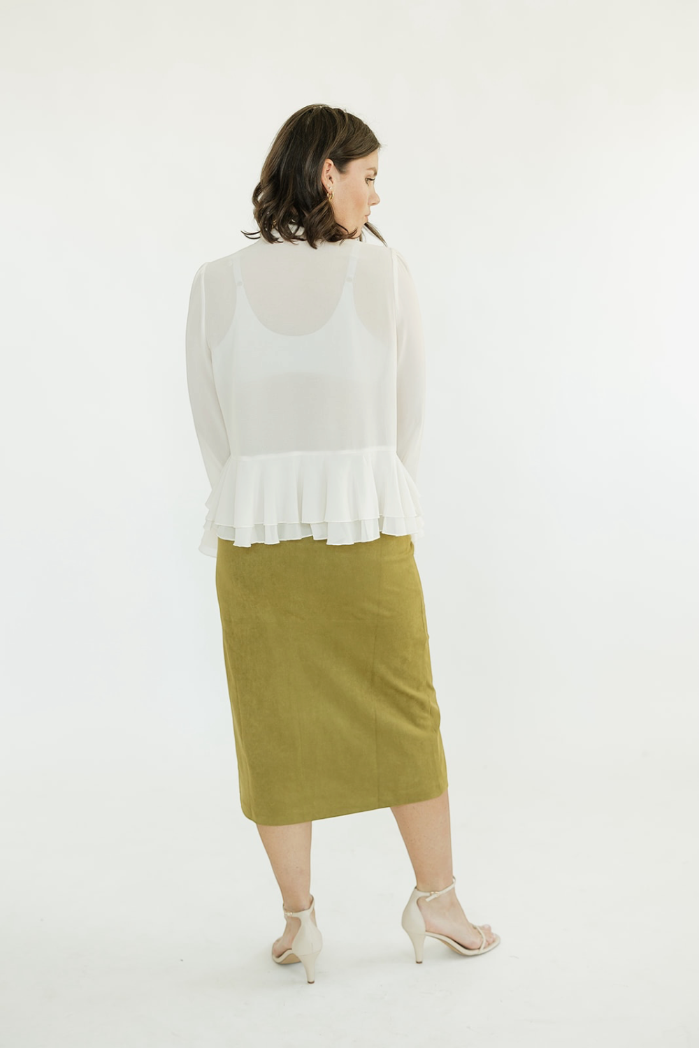 Donna Ivory Peplum Top