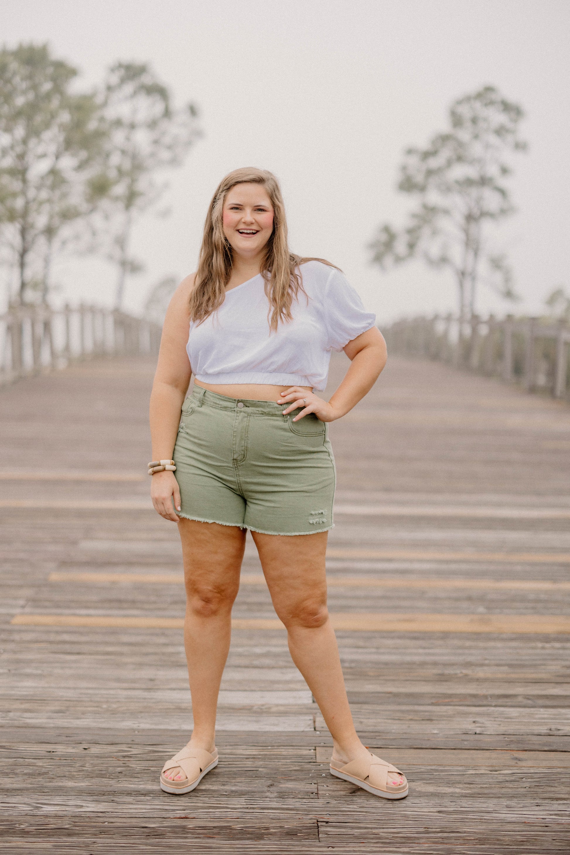 Curvy + Plus Size Denim Shorts in Washed Olive by Hayden LA available at Studio 3:19